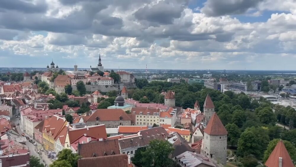 Aerial view of Tallinn’s medieval Old Town with red roofs, stone towers and church spires