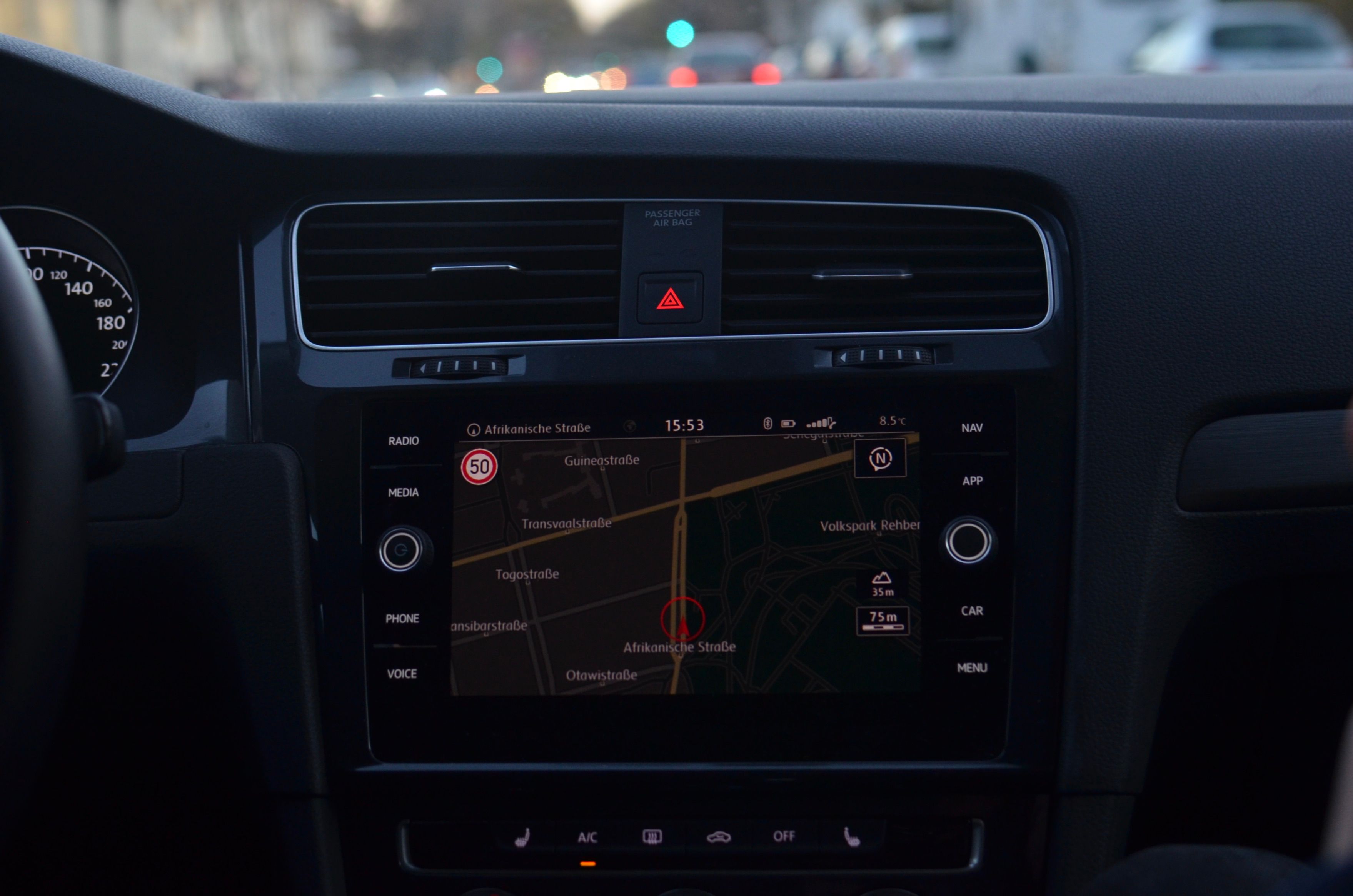 Vehicle dashboard with GPS navigation system showing a planned route through city streets